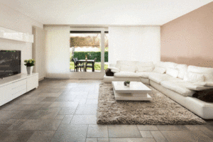 White living room with dark stone tiles